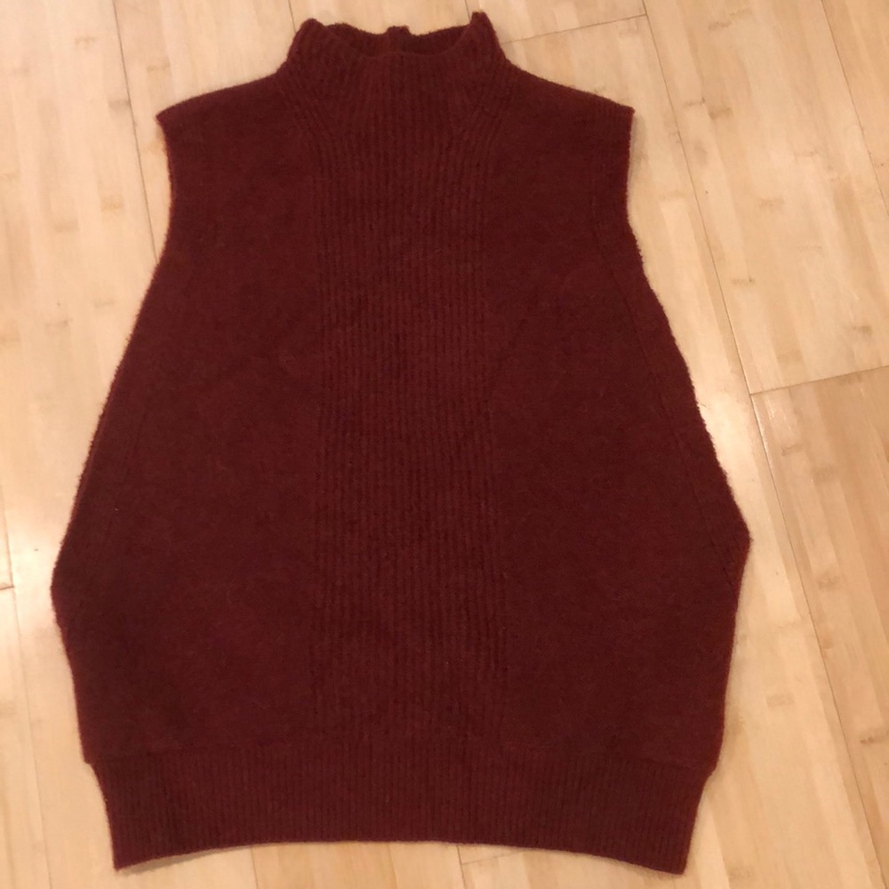 Super soft, mock-neck sleeveless sweater.